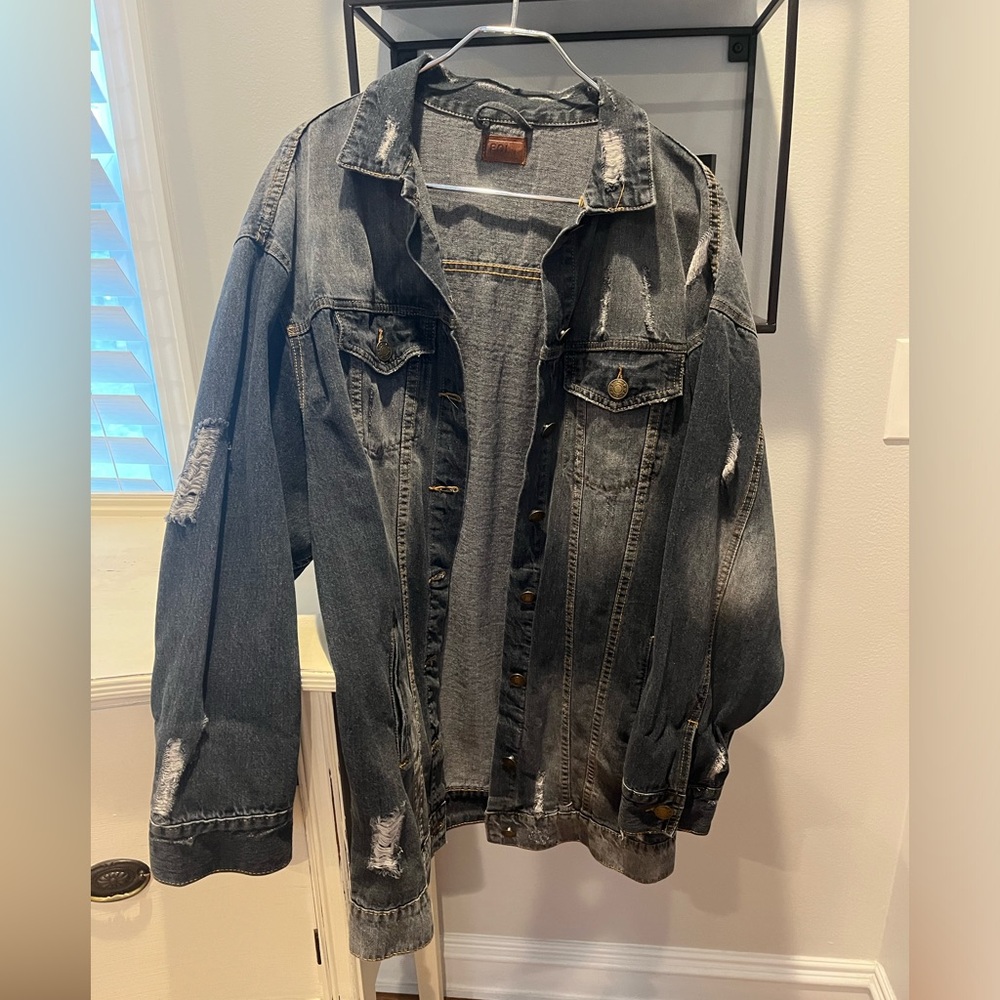 Ladies large distressed jean jacket. Oversized